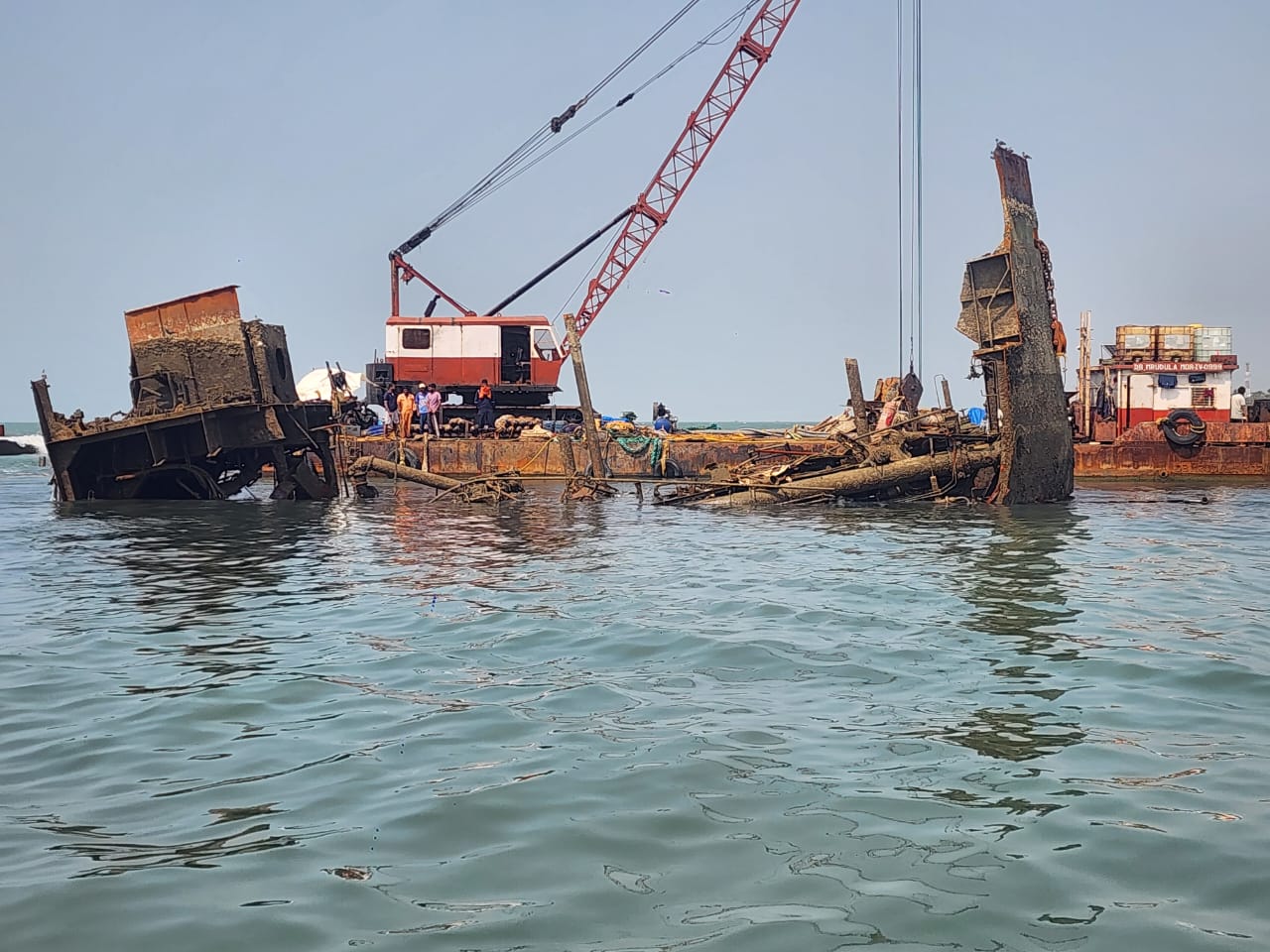 Commercial diver inspecting marine structure underwater